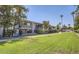 Mid-century modern apartment building with manicured lawn and palm trees at 5150 N 20Th St # 201, Phoenix, AZ 85016