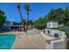Community pool with adjacent fireplace and seating for relaxing at 5150 N 20Th St # 201, Phoenix, AZ 85016