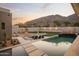 Stunning pool with a mountain view, surrounded by desert landscaping and ample patio space at 5327 N Invergordon Rd, Paradise Valley, AZ 85253