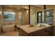 Spa-like bathroom with modern soaking tub, glass shower, and sleek vanity at 5327 N Invergordon Rd, Paradise Valley, AZ 85253