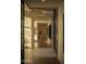 Elegant foyer with stone walls and natural light hardwood flooring at 5327 N Invergordon Rd, Paradise Valley, AZ 85253