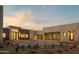 Modern home with a desert landscape, showcasing garage doors at 5327 N Invergordon Rd, Paradise Valley, AZ 85253