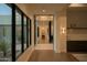 Bright hallway with stone accents and views of the outdoor landscape at 5327 N Invergordon Rd, Paradise Valley, AZ 85253
