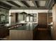 Custom kitchen features double islands, paneled cabinets, and modern pendant lighting at 5327 N Invergordon Rd, Paradise Valley, AZ 85253
