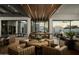 Stunning living room featuring a wooden ceiling, modern lighting, and contemporary furniture at 5327 N Invergordon Rd, Paradise Valley, AZ 85253