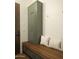 Mudroom features a wood bench with storage, pillows and a shaker cabinet with brass hardware at 5327 N Invergordon Rd, Paradise Valley, AZ 85253
