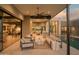 Outdoor living space with comfortable seating, an outdoor kitchen, and views of the pool at 5327 N Invergordon Rd, Paradise Valley, AZ 85253