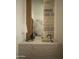Chic powder room features a stone sink and a decorative mirror with stone accent wall at 5327 N Invergordon Rd, Paradise Valley, AZ 85253