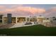 Stunning modern home with lush green grass, a beautiful pool and modern desert landscaping at 5327 N Invergordon Rd, Paradise Valley, AZ 85253