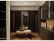 Spacious walk-in closet with custom shelving and a comfortable seating area atop a cowhide rug at 5327 N Invergordon Rd, Paradise Valley, AZ 85253