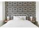 Bedroom featuring a metal bed frame and a black and white patterned wall at 5366 E Juniper Ave, Scottsdale, AZ 85254