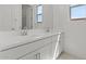Elegant bathroom featuring a double sink vanity with modern fixtures and bright lighting at 564 E Aurora Dr, San Tan Valley, AZ 85140