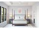 Spacious bedroom featuring a post bed and stylish wall paper at 564 E Aurora Dr, San Tan Valley, AZ 85140