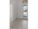 Bright foyer with tile flooring and a modern front door with glass panels offering views of the outdoors at 564 E Aurora Dr, San Tan Valley, AZ 85140