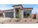 Charming single-story home with modern design elements and a well-maintained desert landscaped front yard at 564 E Aurora Dr, San Tan Valley, AZ 85140