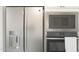 Stainless steel refrigerator, microwave, and wall oven at 564 E Aurora Dr, San Tan Valley, AZ 85140