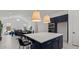 Open concept kitchen with white countertops, navy blue cabinets, and a large island for dining at 564 E Aurora Dr, San Tan Valley, AZ 85140