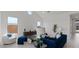 Bright living room with modern decor, accent furniture, and large windows providing natural light at 564 E Aurora Dr, San Tan Valley, AZ 85140