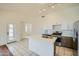 Modern kitchen with island and stainless steel appliances at 7740 E Olla Ave, Mesa, AZ 85212