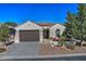 Single-story home with brown garage door and landscaped front yard at 7850 W Discovery Way, Florence, AZ 85132