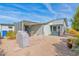 Backyard with covered patio, grill, and gravel landscaping at 8500 E Southern Ave # 577, Mesa, AZ 85209