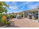 Landscaped backyard with patio, grill, and covered seating area at 8500 E Southern Ave # 577, Mesa, AZ 85209