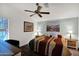 Main bedroom with king-size bed and wood-look floors at 8500 E Southern Ave # 577, Mesa, AZ 85209