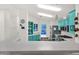 Kitchen with teal cabinets, stainless steel appliances, and ample counter space at 8500 E Southern Ave # 577, Mesa, AZ 85209