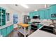 Teal kitchen with stainless steel appliances and butcher block island at 8500 E Southern Ave # 577, Mesa, AZ 85209