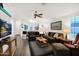 Living room with cozy seating, wood-look floors and kitchen views at 8500 E Southern Ave # 577, Mesa, AZ 85209
