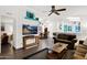 Bright living room with comfy seating, a large TV, and wood-look flooring at 8500 E Southern Ave # 577, Mesa, AZ 85209