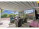 Covered patio with wicker seating, a grill, and a heater at 8500 E Southern Ave # 577, Mesa, AZ 85209
