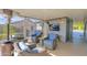 Covered patio with wicker seating, a TV, and a heater at 8500 E Southern Ave # 577, Mesa, AZ 85209