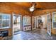 Bright sunroom features wood ceiling, tile floor, and access to backyard at 8500 E Southern Ave # 577, Mesa, AZ 85209