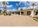 View of the backyard showcasing a screened in porch and plenty of room at 9735 W Country Club Dr, Sun City, AZ 85373