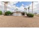 Home exterior showing well-manicured landscaping and a view of the screened in porch at 9735 W Country Club Dr, Sun City, AZ 85373