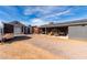 Backyard with patio, gravel area and detached garage at 9823 W Pacifico Dr, Arizona City, AZ 85123