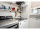 Laundry room with washer, dryer, and shelving at 9823 W Pacifico Dr, Arizona City, AZ 85123