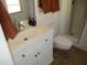 Bathroom with toilet, shower, and updated vanity at 9827 W Lindgren Ave, Sun City, AZ 85373