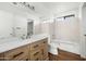 Modern bathroom with a large vanity and bathtub at 10024 W Montecito Ave, Phoenix, AZ 85037