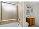 Bathroom with shower/tub combo and wood vanity at 10024 W Montecito Ave, Phoenix, AZ 85037