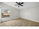 Bright bedroom with ceiling fan and tile flooring at 10024 W Montecito Ave, Phoenix, AZ 85037