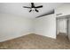 Spacious bedroom with ceiling fan and tile flooring at 10024 W Montecito Ave, Phoenix, AZ 85037