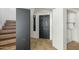 Entryway with stairs, interior door and laundry closet at 10024 W Montecito Ave, Phoenix, AZ 85037