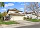 Two-story house with attached garage and grassy front yard at 10024 W Montecito Ave, Phoenix, AZ 85037