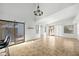 Spacious living room with tile floors and access to backyard at 10024 W Montecito Ave, Phoenix, AZ 85037