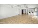 Open living room and kitchen with tile floors at 10024 W Montecito Ave, Phoenix, AZ 85037