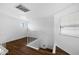 Open loft area with wood flooring and a staircase at 10024 W Montecito Ave, Phoenix, AZ 85037