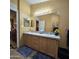 Bathroom with double vanity, wooden cabinets and plenty of storage at 11411 N 91St Ave # 225, Peoria, AZ 85345