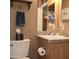 Bathroom vanity with sink, gray countertop and wooden cabinet and silver fixtures at 11411 N 91St Ave # 225, Peoria, AZ 85345